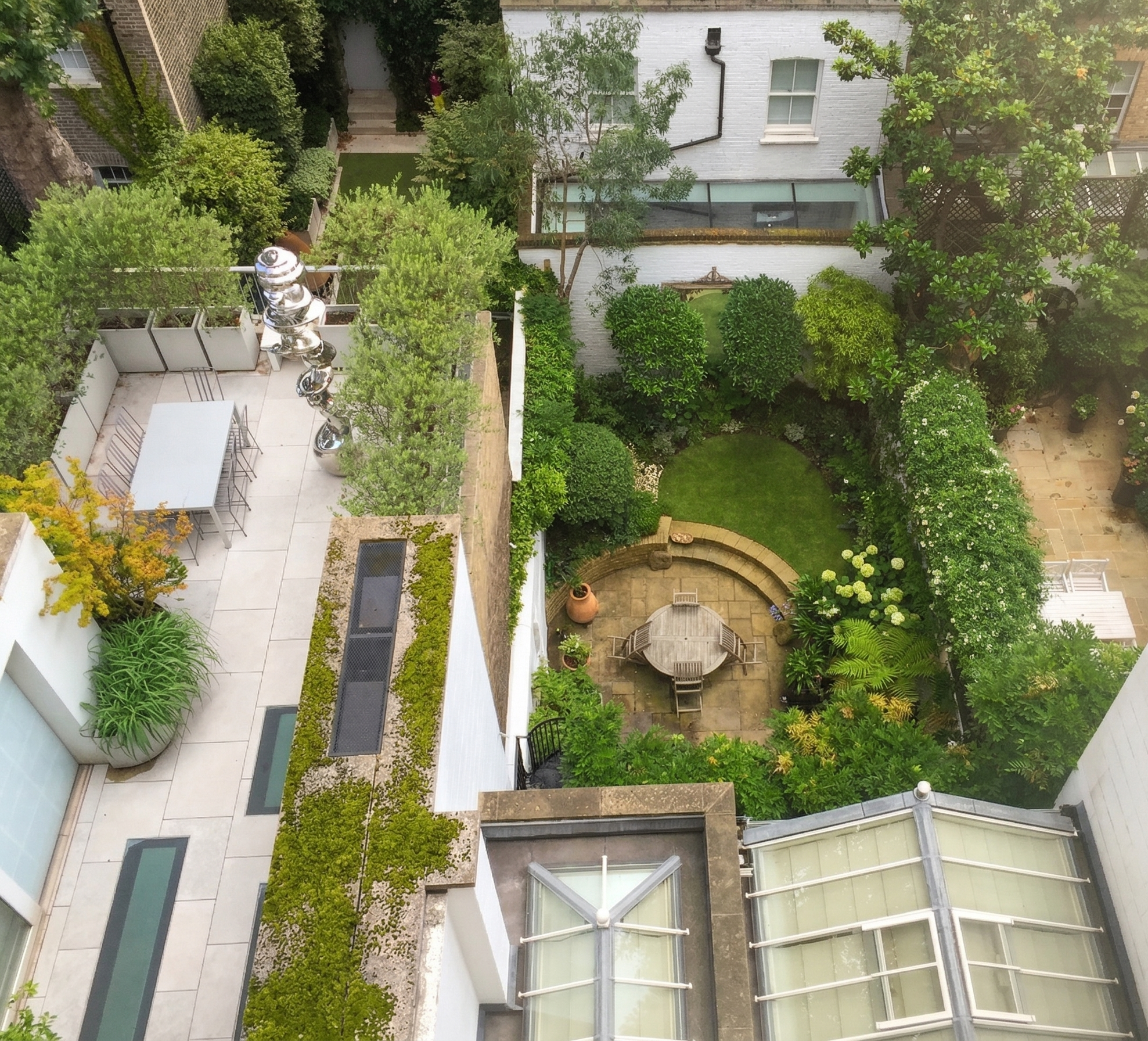 A high-end landscape construction project by Holmes Gardens, showcasing structural harmony and bespoke architectural build in a private London townhouse garden.