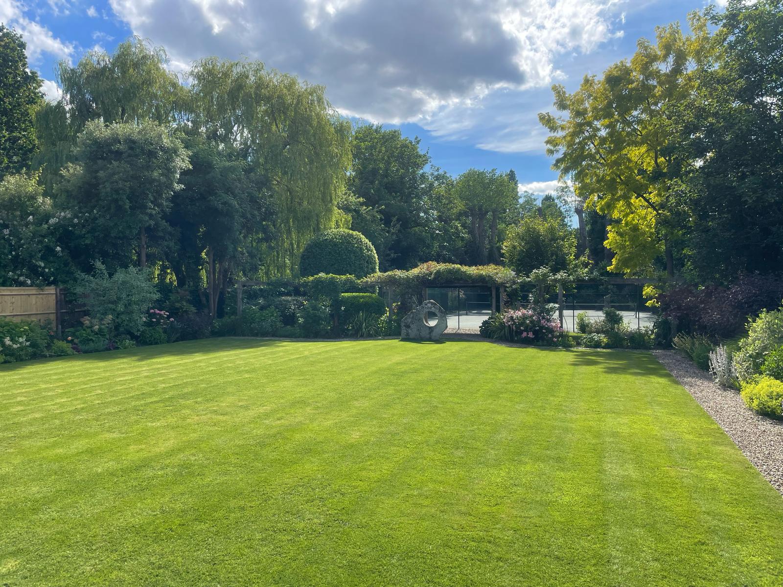 High-end turf management for expansive London estates. This perfectly striped lawn highlights our dedication to horticultural health and visual symmetry, creating a serene backdrop for refined outdoor living in Chelsea and Dulwich.